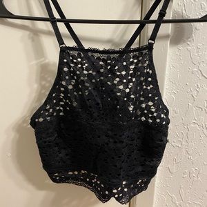 Black crop top . Size small . Covers the cleavage